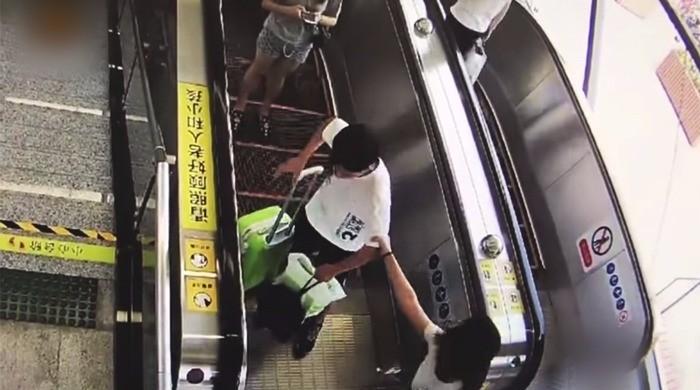 Woman hauls harasser to police in Chinese subway