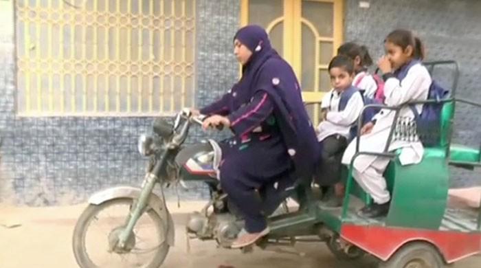 Woman makes living by riding motorcycle-rickshaw in Rahim Yar Khan 