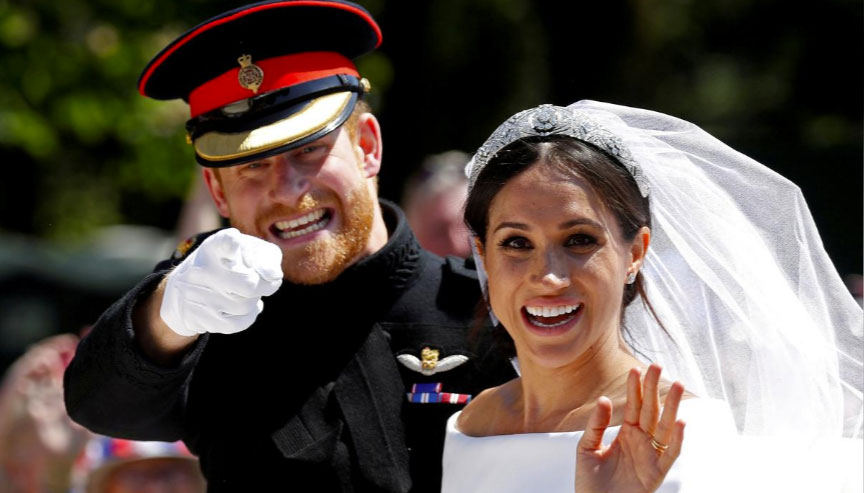 Britain’s Prince Harry and Meghan Markle gesture on their wedding day. — Reuters/File