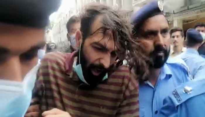 Zahir Jaffer, the alleged killer of Noor Mukadam, brought to the court in handcuffs, on July 26, 2021. &mdash; Twitter/Senator Sehar Kamran