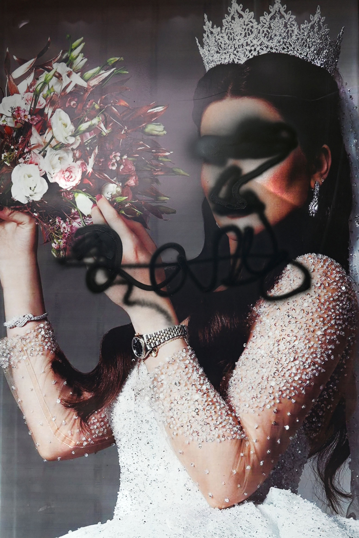 The facade of a beauty saloon is pictured with images of women defaced using a spray paint in Shar-e-Naw in Kabul on August 18, 2021. &mdash; AFP/File