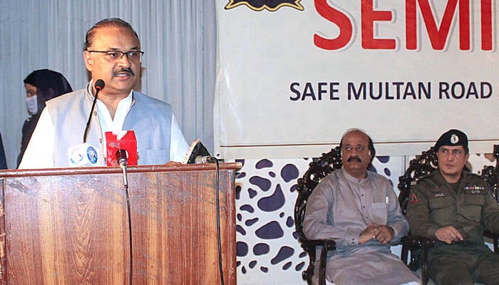 SAPM Malik Amir Dogar addresses a road safety seminar organised by City Traffic Police in Multan on August 7, 2021. — APP/File