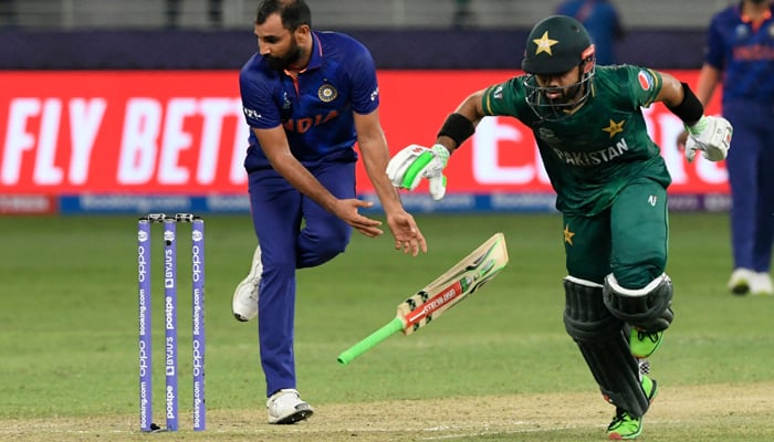 Pakistan´s Mohammad Rizwan (2R) takes the winning run in the ICC menâ€™s Twenty20 World Cup cricket match between India and Pakistan at the Dubai International Cricket Stadium in Dubai on October 24, 2021. — AFP