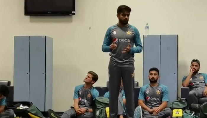 Pakistan’s captain Babar Azam speaks to his teammates after their historic win against India in the T20 World Cup in Dubai on October 24, 2021. — Twitter