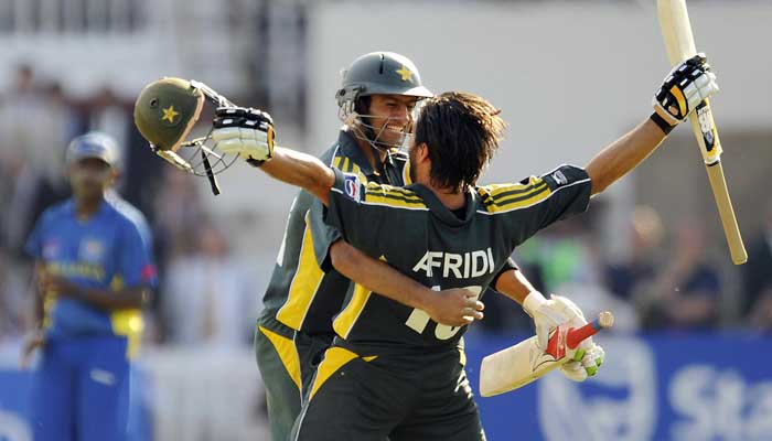 Former Pakistan captains Shoaib Malik and Shahid Afridi embrace each other after winning the 2009 T20 World Cup. Photo: AFP