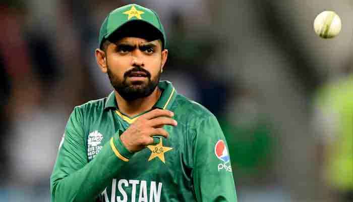 Pakistan captain Babar Azam throws the ball during an ICC Mens T20 World Cup cricket match between Afghanistan and Pakistan at the Dubai International Cricket Stadium in Dubai on October 29, 2021. Photo: AFP