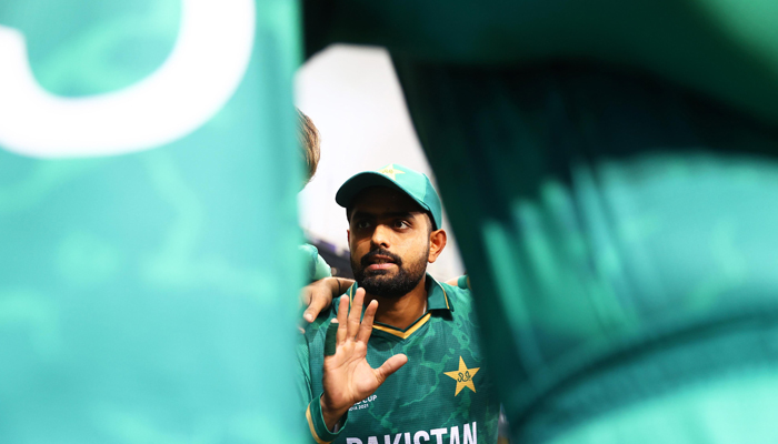 Pakistan skipper Babar Azam speaks to his teammates. — Twitter/ICC