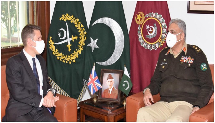 British High Commissioner Christian Turner (L) and Chief of Army Staff General Qamar Javed Bajwa. — ISPR.