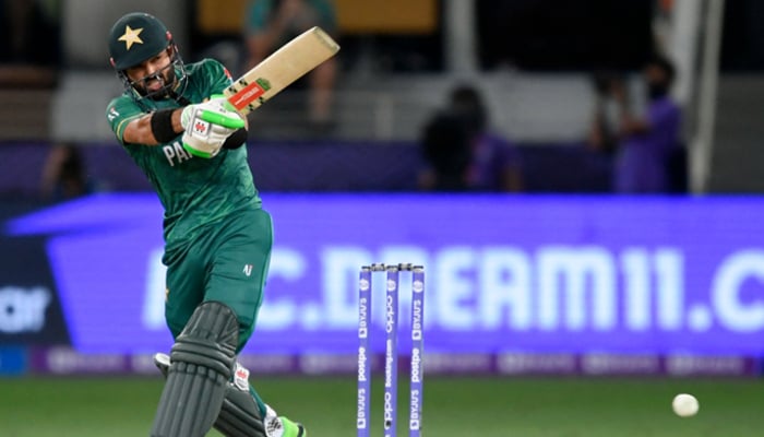 Pakistans Mohammad Rizwan plays a shot during the ICC Twenty20 World Cup semi-final match between Australia and Pakistan at the Dubai International Cricket Stadium in Dubai on November 11, 2021. AFP
