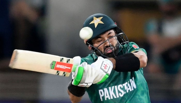 Pakistan´s Mohammad Rizwan plays a shot during the ICC T20 World Cup semi-final match between Australia and Pakistan at the Dubai International Cricket Stadium in Dubai on November 11, 2021. — AFP