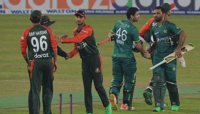 Pakistans and Bangladeshs cricketers greet each other after Pakistans victory at the end of the second Twenty20 international cricket match between Bangladesh and Pakistan at the Sher-e-Bangla National Cricket Stadium in Dhaka on November 20, 2021. — AFP