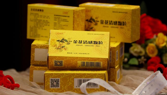 Packs of Chinese traditional herbal medicine Jinhua Qinggan Granules (JHQG) for the treatment of coronavirus (COVID-19) disease are displayed during a ceremony after completion of clinical trial on the efficacy and safety, at the International Centre for Chemical and Biological Sciences of Karachi University in Pakistan January 17, 2022. &mdash; Reuters