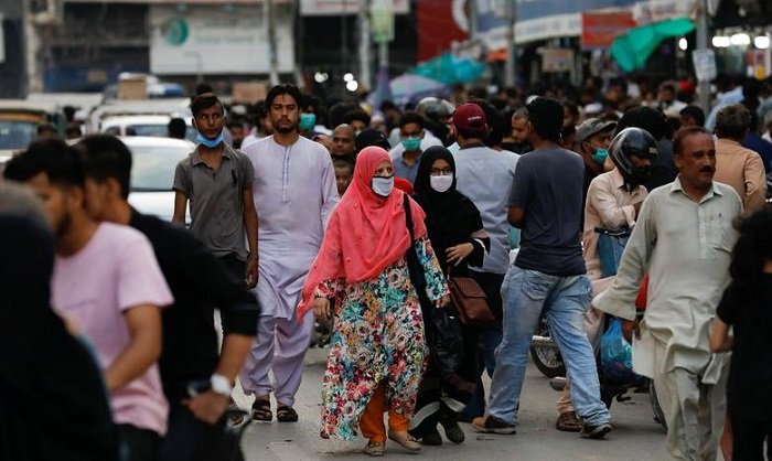 Women shop wearing mask shop in Karachi.&nbsp;&mdash; Reuters.