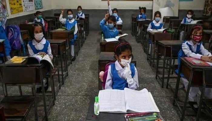 School children can be seen studying wearing masks.— Reuters/File