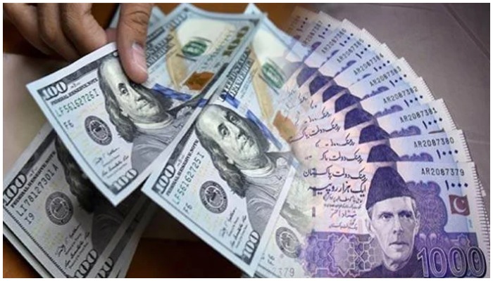 A combo of pictures of US dollar bills and Pakistani rupee notes.&nbsp;&mdash; Reuters/File