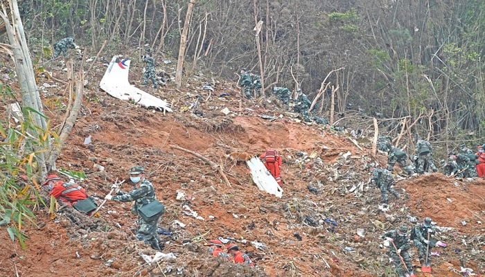 Rescuers search for the black boxes at a plane crash site in Tengxian county of Wuzhou, Guangxi Zhuang Autonomous Region, China March 22, 2022. A China Eastern Airlines passenger plane, flight MU5735, crashed into the mountainside on Monday. &mdash; Reuters