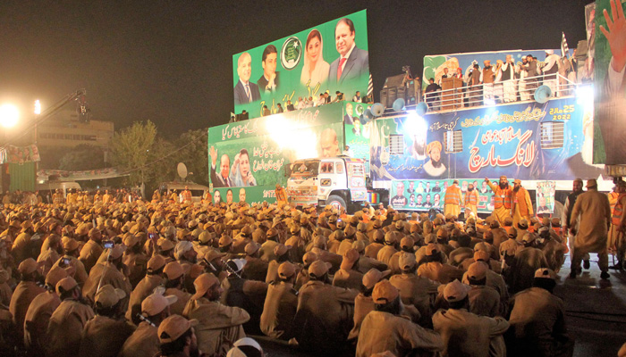 Workers of JUI-F sits in front of the stage during Pakistan Democratic Movement (PDM) long march at sector H-9 in Islamabad. -Online