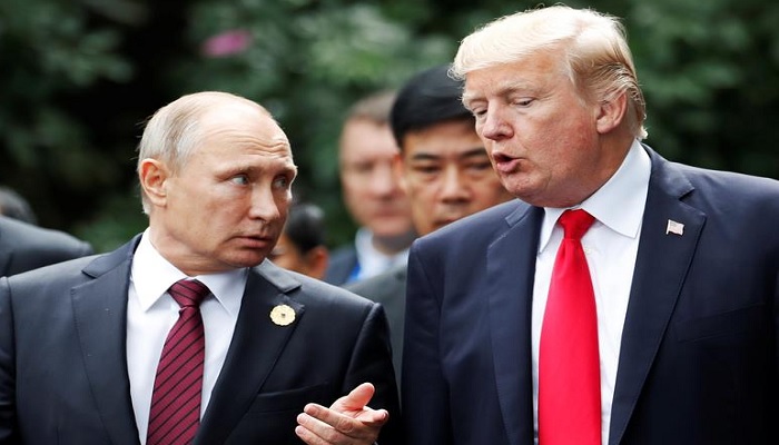 File Picture: U.S. President Donald Trump and Russias President Vladimir Putin talk during the family photo session at the APEC Summit in Danang, Vietnam November 11, 2017. &mdash; Reuters