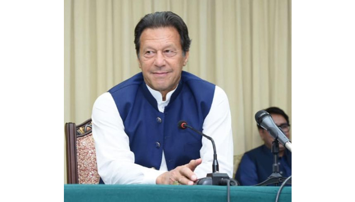 Prime Minister Imran Khan talking to his party leaders. — Instagram