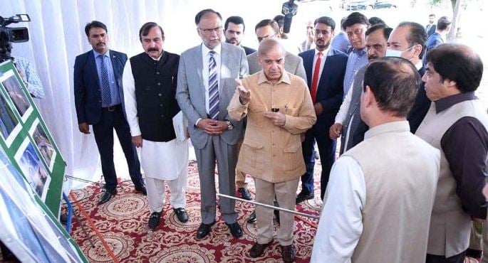 Prime Minister Shehbaz Sharif receives briefing regarding progress on the construction of Rawal Chowk Flyover. — APP