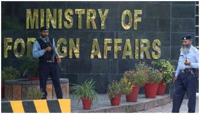 Security guards stand outside the Ministry of Foreign Affairs in Islamabad. — AFP