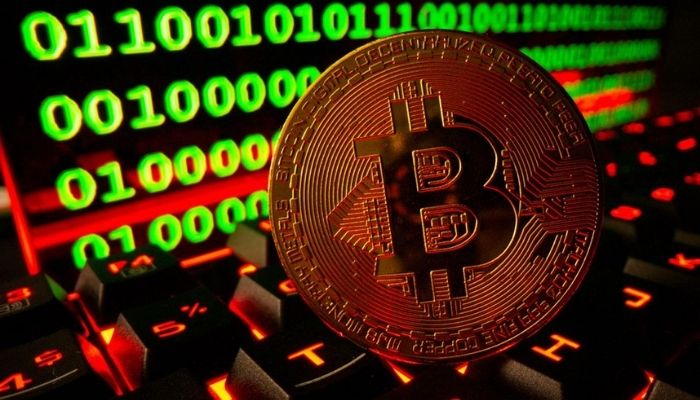 Bitcoin cryptocurrency representation is pictured on a keyboard in front of binary code in this illustration taken September 24, 2021. — Reuters