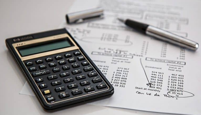 A representational image of calculator and planning sheet. — Reuters