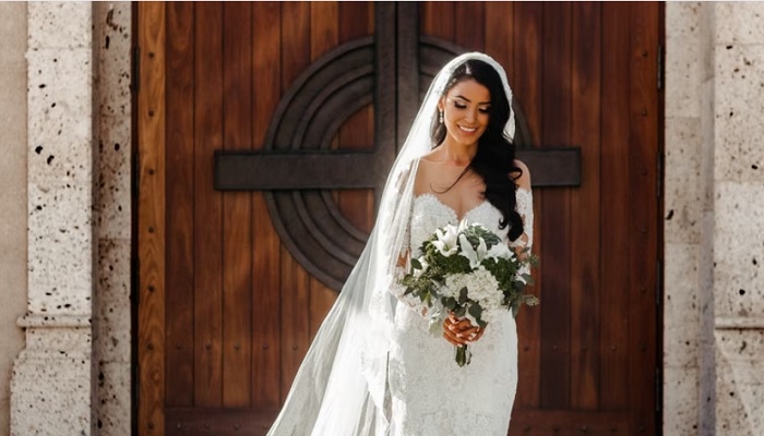 Bridesmaid wears bridal dress to friends wedding. &mdash; Unsplash/Thomas Christian