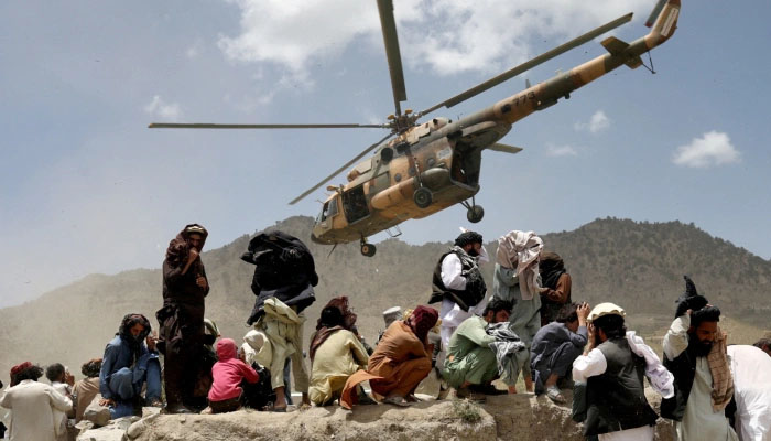 A Taliban helicopter departs after delivering aid to the earthquake site in Gayan, Afghanistan &mdash; Reuters