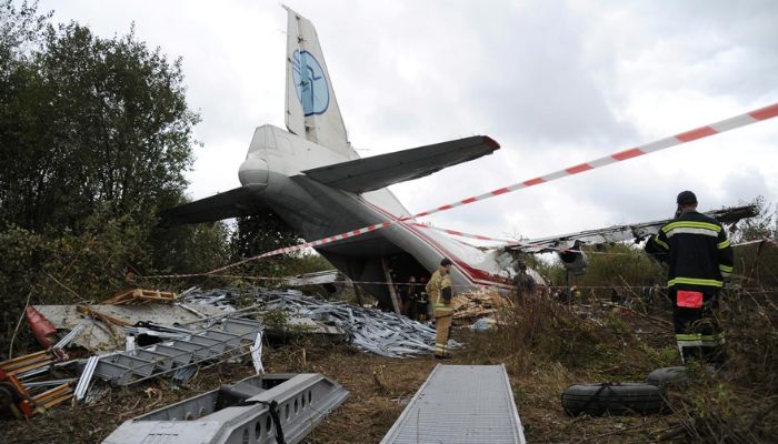 Members of emergency services work at the site of the Antonov-12 cargo airplane emergency landing in Lviv region, Ukraine October 4, 2019. &mdash;Reuters