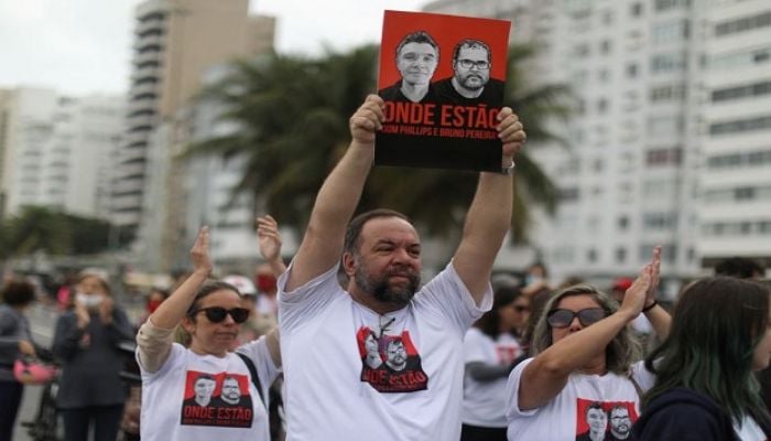 Relatives of British journalist Dom Phillips wife hold placards during a protest following the Amazon disappearance of Phillips and indigenous expert Bruno Araujo Pereira, at Copacabana beach, Rio de Janeiro, Brazil June 12, 2022. &mdash; Reuters