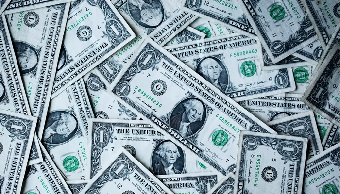Dollar bills. &mdash; Unsplash