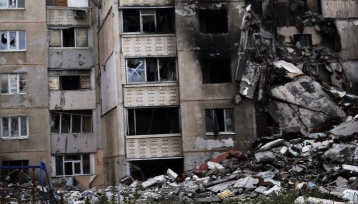 A book is seen on a playground in front of a building destroyed by a military strike, as Russias invasion of Ukraine continues, in northern Saltivka, in Kharkiv, Ukraine July 13, 2022. Photo&mdash;REUTERS/Nacho Doce