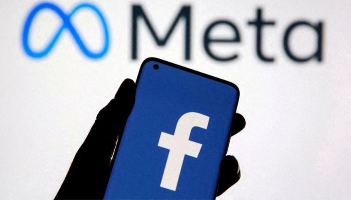 A smartphone with Facebooks logo is seen with new rebrand logo Meta in this illustration taken October 28, 2021. &mdash; Reuters