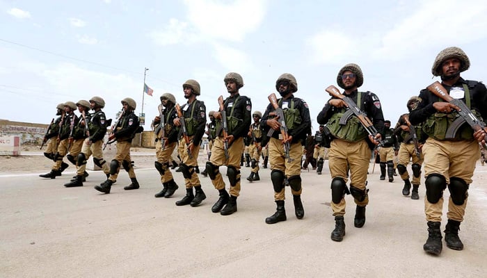 Security personnel stand high alert during the procession on 9th Muharram-ul-Haram to safeguard the mourners. &mdash;APP