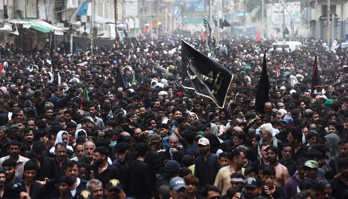 Mourners take part in a procession on the tenth day of Ashura during the Islamic month of Muharram, in Karachi on August 9, 2022. &mdash; AFP