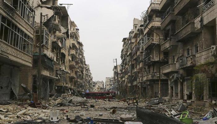A bus blocks a road amid damage on the Salah Al-Din neighbourhood frontline in Aleppo, December 6, 2014.&mdash; Reuters/File