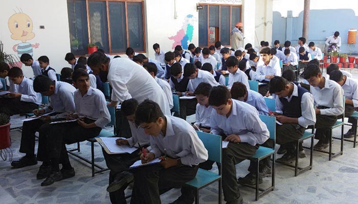 Students sit for a final exam. &mdash; AFP/ File