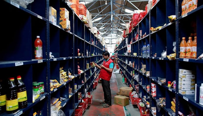 An employee scans a package for an order at a BigBasket warehouse on the outskirts of Mumbai, on November 4, 2014. &mdash; Reuters