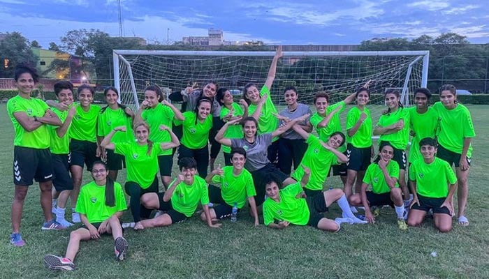 A representational image of women playing football. &mdash; PFF