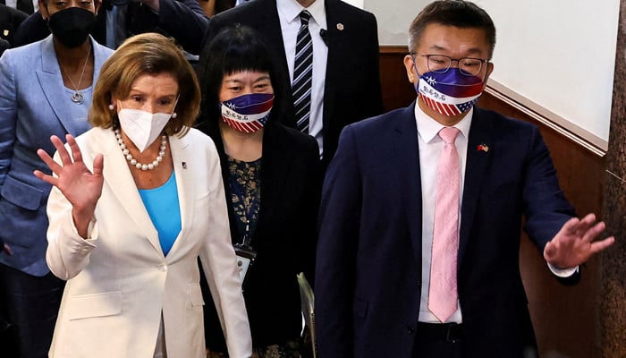 US House of Representatives Speaker Nancy Pelosi walks next to Legislative Yuan Vice President Tsai Chi-chang as she leaves the parliament in Taipei, Taiwan August 3, 2022. &mdash; Reuters