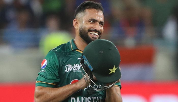 Pakistans Mohammad Nawaz smiles as he wears his helmet during the Asia Cup Twenty20 international cricket Super Four match between India and Pakistan at the Dubai International Cricket Stadium in Dubai on September 4, 2022.&mdash; AFP/File