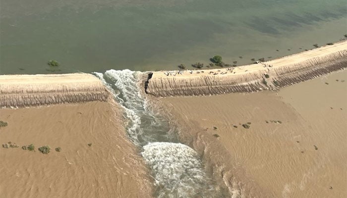 An aerial view of a breach made at the embankment of Manchhar Lake. &mdash; Twitter