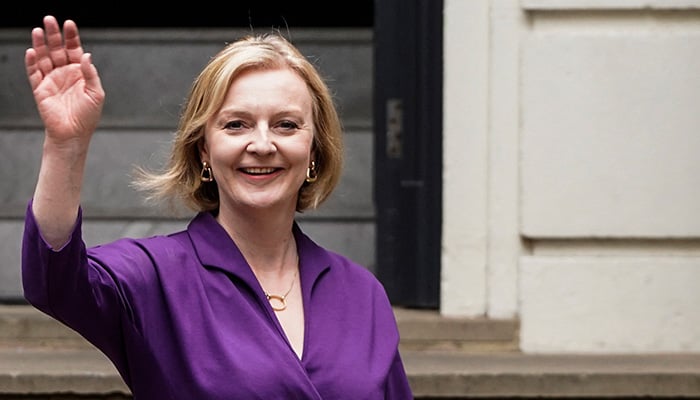 New Conservative Party leader and incoming prime minister Liz Truss waves as she leaves the Conservative Party Headquarters in central London having been announced the winner of the Conservative Party leadership contest at an event in central London on September 5, 2022. — AFP
