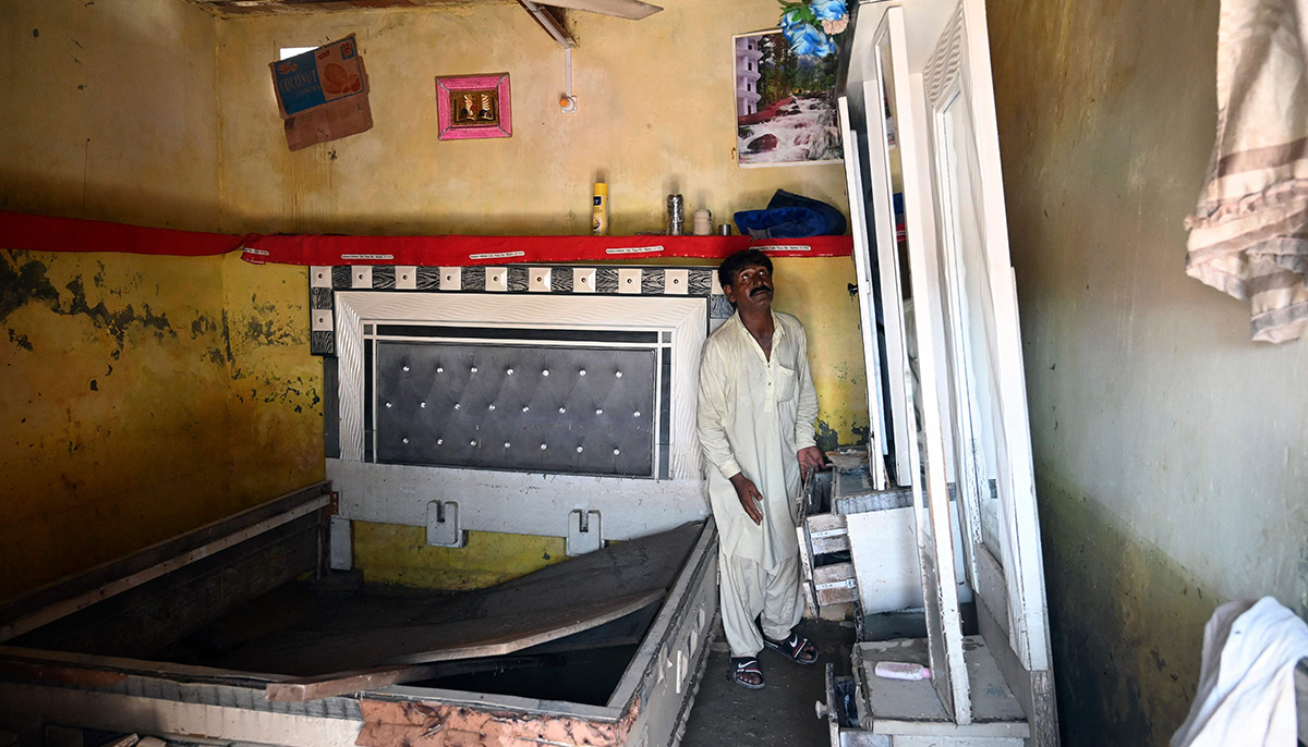 Mureed Hussain looks at the dowry furniture of his daughter&acute;s wedding which was damaged by flood waters at his house in Fazilpur, Rajanpur district of Punjab province on September 3, 2022. &mdash; AFP