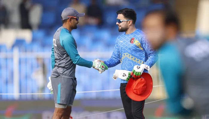 Pakistan skipper Babar Azam (L) and Afghanistan league spinner Rashid Khan. — Twitter