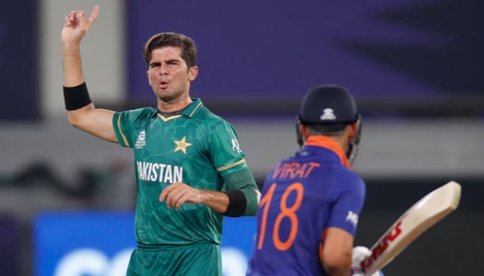 Pakistans pace spearhead Shaheen Shah Afridi gestures during a match against India as the Men In Blues former skipper Virat Kohli looks on. — Reuters/File