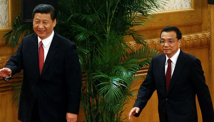 Xi Jinping and Li Keqiang arrive to meet with the press at the Great Hall of the People in Beijing, China November 15, 2012. — Reuters