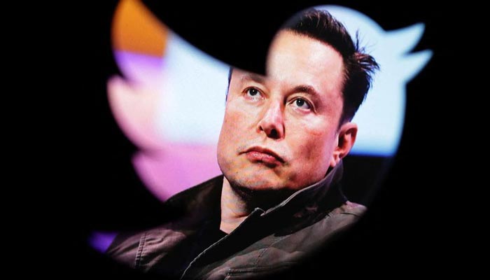 Elon Musks photo is seen through a Twitter logo in this illustration taken October 28, 2022. — Reuters