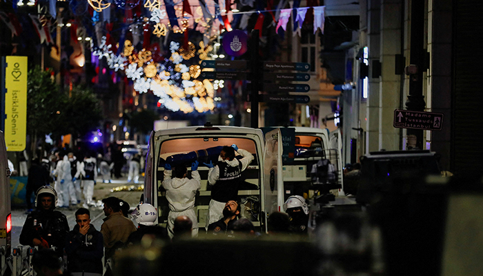 Police members transport the body of an unidentified person after an explosion on busy pedestrian Istiklal street in Istanbul, Turkey, November 13, 2022. — Reuters